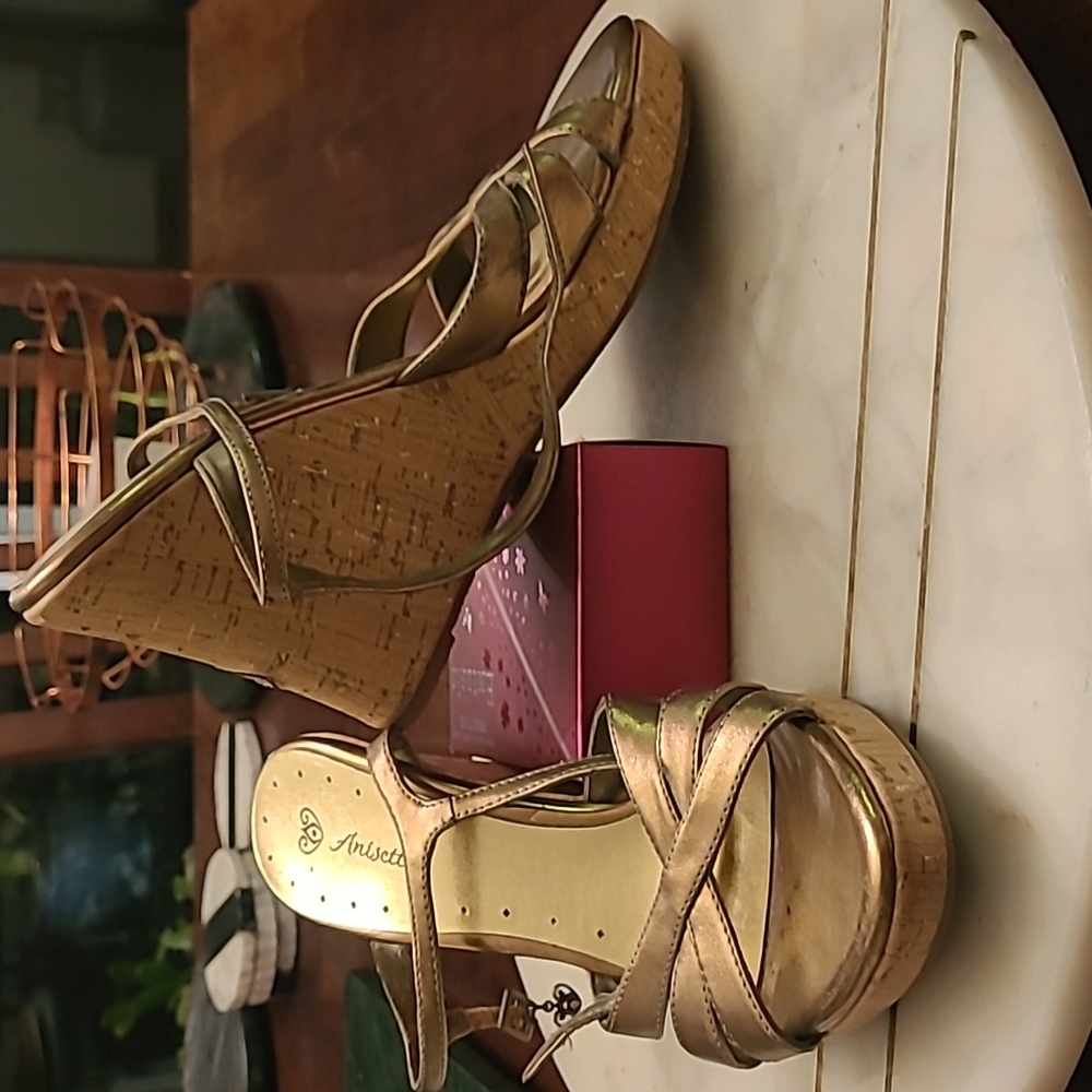 Gold and cork wedge sandals with embroidered floral and rhinstone detail.